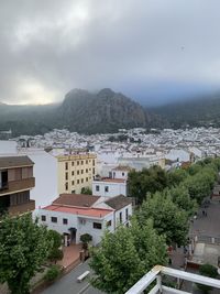 High angle view of buildings in town against sky