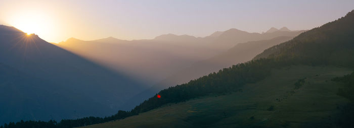 Scenic view of mountains against sky during sunset