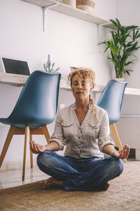 Woman meditating at home