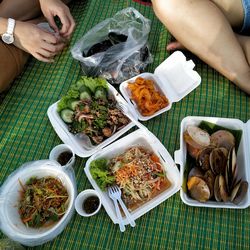 High angle view of people having food on table