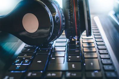 Close-up of headphones on laptop