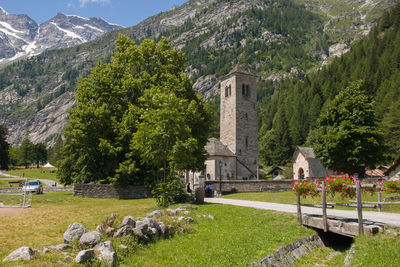 View of little church and bridge in the center of macugnaga alpine village at the foot of monte rosa