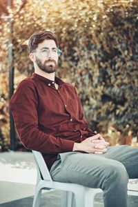 Young man sitting on sofa