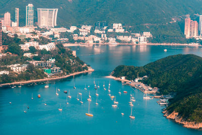 View of boats middle islands buildings in seaside at deep water bay hong kong seen form brick hill 