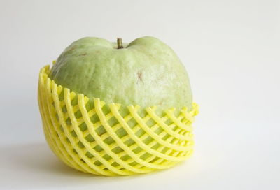 Close-up of fruit against white background