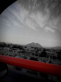 High angle view of buildings in town against sky