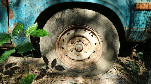 Close-up of flat tire of old abandoned truck