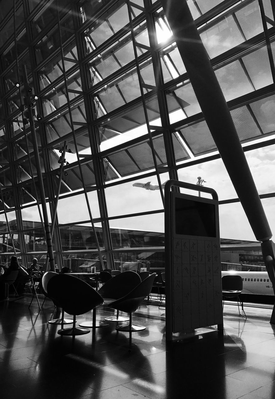 indoors, transportation, built structure, airport, architecture, airport departure area, travel, chair, modern, transportation building - type of building, no people, technology, day, seat