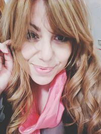 Close-up portrait of a smiling young woman