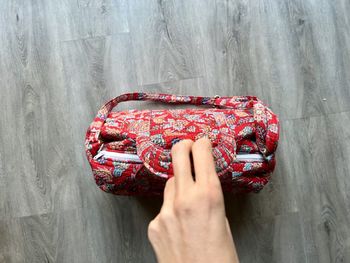 Cropped hand of woman holding gift