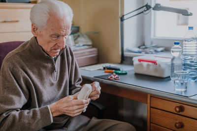 Senior man holding bandages