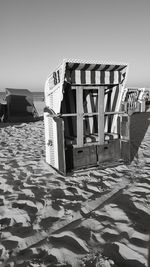 Lifeguard hut on beach against clear sky