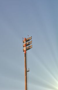 Low angle view of communications tower against sky