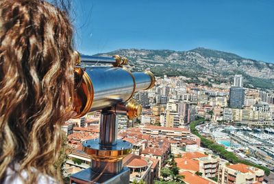 Rear view of woman looking at city buildings