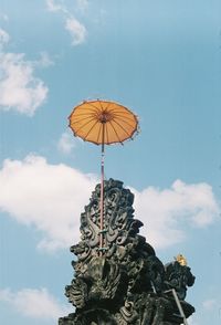 Low angle view of statue against sky