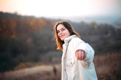 Portrait of a young woman on a sunny day in autumn