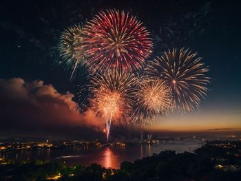 Low angle view of firework display at night