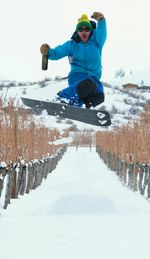 Man jumping in snow