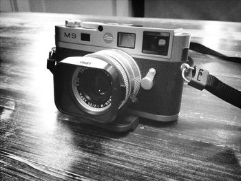 Close-up of camera on table