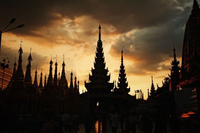 Low angle view of silhouette temple against sky during sunset