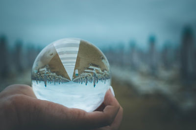 Close-up of person hand holding ball