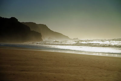 Scenic view of beach against sky