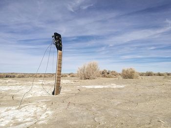 Windmill on field against sky