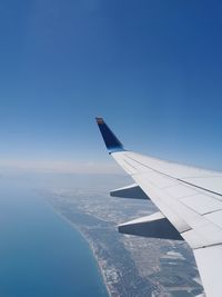 Airplane flying over blue sky