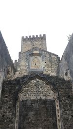 Low angle view of old building against clear sky