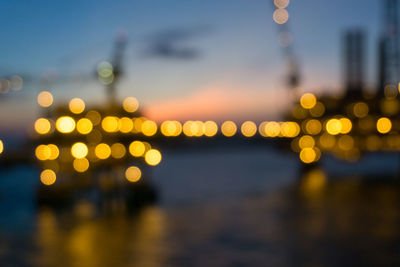 Defocused image of illuminated city at night
