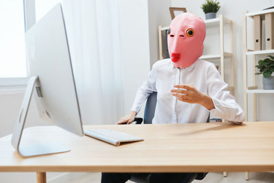 Portrait of young woman working in office