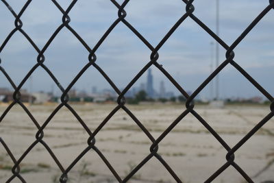 Chainlink fence seen through chainlink fence