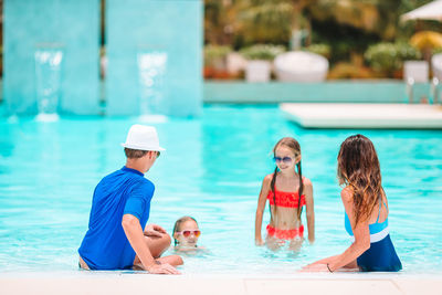 People enjoying in swimming pool
