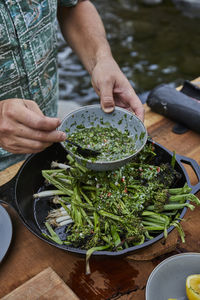 Chimichurri over roasted vegetables in cast iron pan