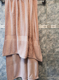 Low section of woman standing on tiled floor