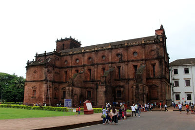 Group of people in front of historical building