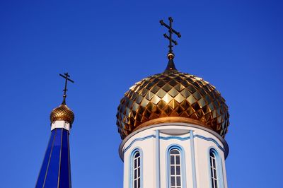 Low angle view of traditional building against blue sky