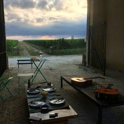 High angle view of breakfast on table by river against sky