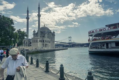 View of bridge over river in city