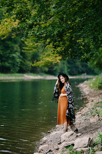 Woman standing by river