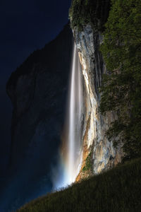 The view of staubbach waterfall at night when it is illuminated. lauterbrunnen, switzerland