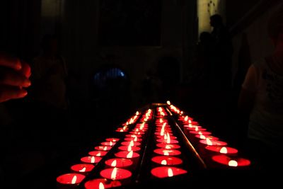 Midsection of person at illuminated nightclub