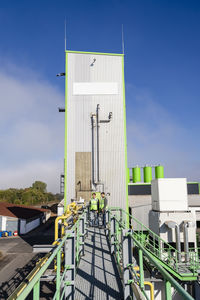 Businessmen standing at recycling plant