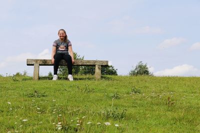 Woman sitting on field