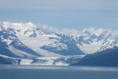 Idyllic view of snowcapped mountains against sky