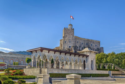 Low angle view of historical building against blue sky