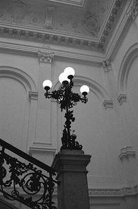 Low angle view of street light against building