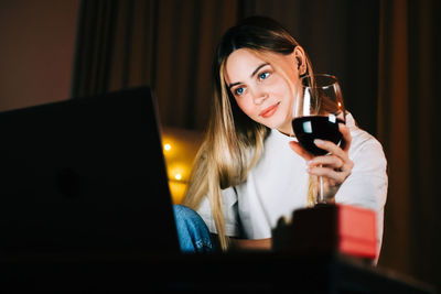 Portrait of young woman using smart phone