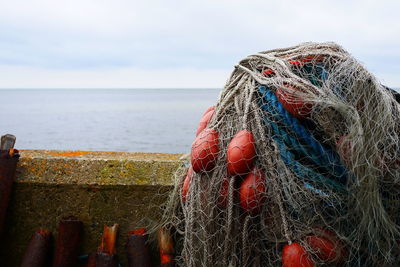 Fishing net by retaining wall against sea