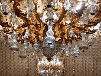 Low angle view of chandelier hanging on ceiling